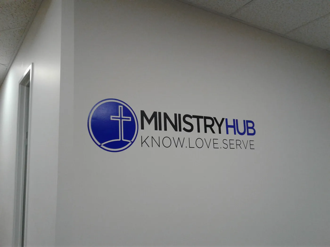 Cut vinyl logo and lettering on an interior wall