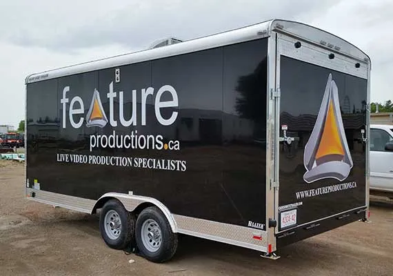 Fully wrapped black enclosed trailer